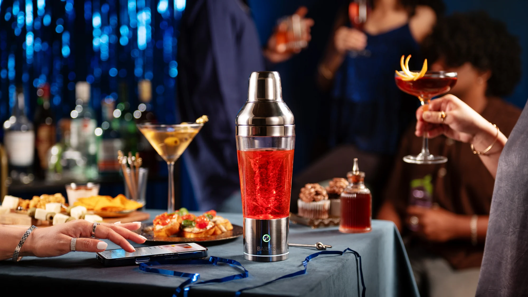 Shaker Pro, a finished cocktail, and the glow of an evening at home